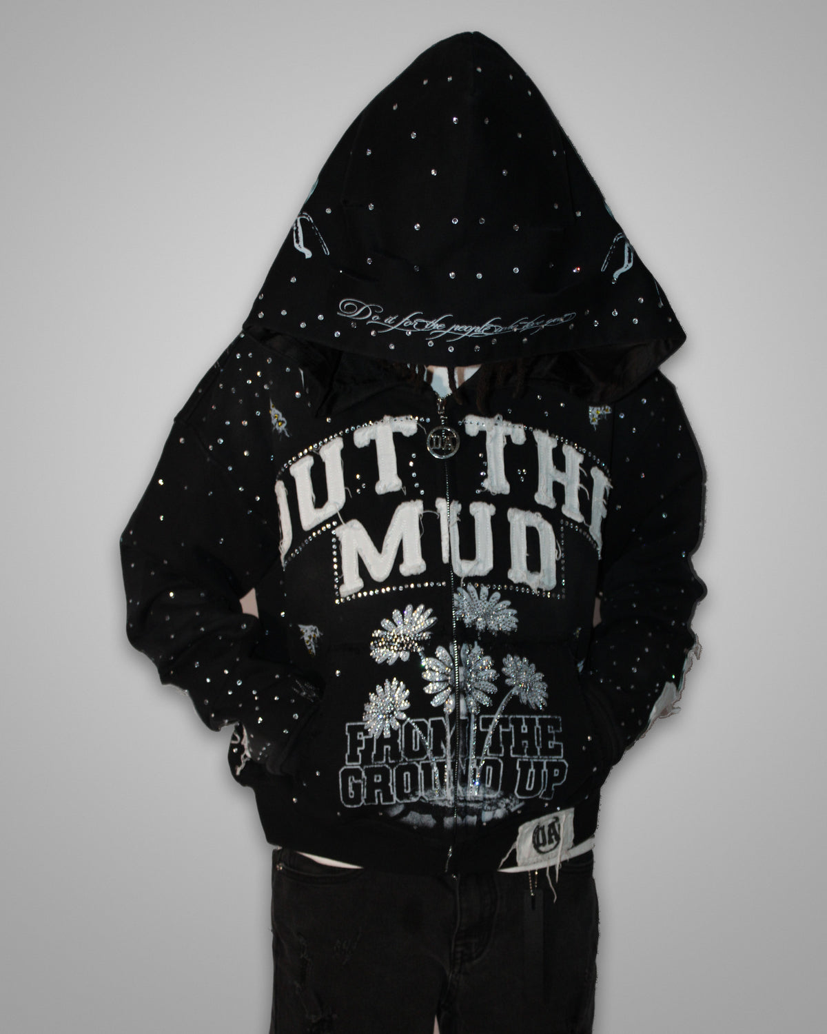OUT THE MUD rhinestone zip-up hoodie in black, worn with the hood up, front