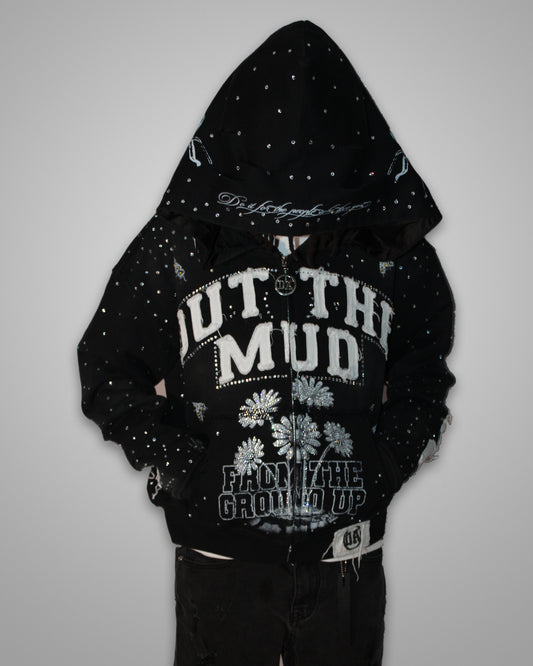 OUT THE MUD rhinestone zip-up hoodie in black, worn with the hood up, front